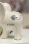 Preview: Deko-Elefant Leon mit Glücksblatt creme weiß 8 cm